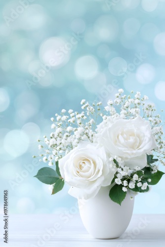 abstract background with white roses and baby breath flowers in a vase, pastel blue bokeh lights of a birthday party banner