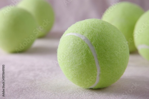 closeup of tennis balls, textured background