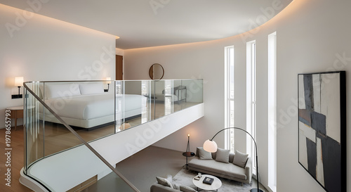 Elegant hotel suite interior with modern design featuring a mezzanine level bedroom overlooking a stylish living area and natural light