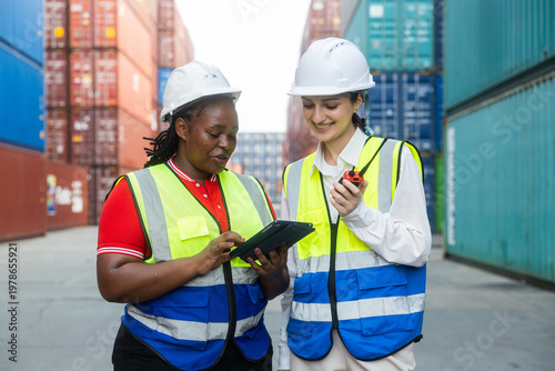 Female supervisors inspecting container yard operations