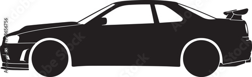 Black modified sports car with spoiler in dark silhouette side view