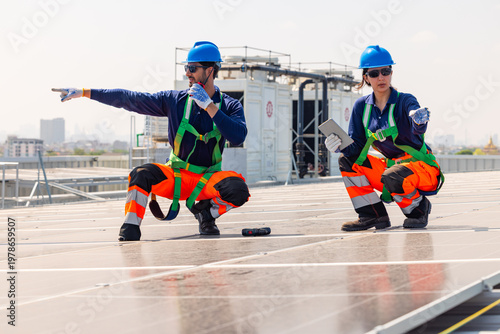 Solar Technicians Inspecting Rooftop Photovoltaic Panels