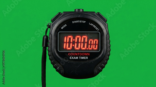 A black digital countdown exam timer watch on a green background