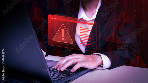 Bild auf Leinwand Cybersecurity Alert: A determined professional in a dark suit intensely works on a laptop, a digital warning signal casting a glow, signifying the vigilance required in today's digital landscape