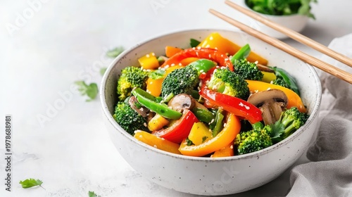 Vibrant Vegetable Stir-Fry Bowl with Chopsticks, Healthy and Delicious Meal.