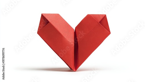 A red paper heart, folded precisely in origami style, stands isolated on a white background