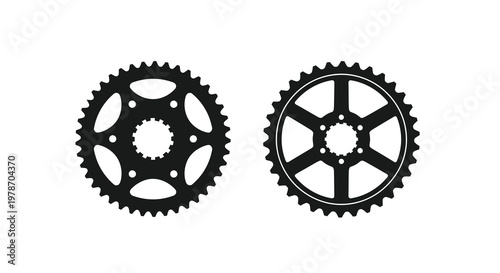 Two black bicycle chainrings isolated on a white background