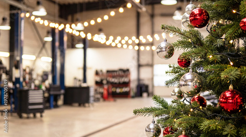 Christmas tree in a car repair shop, auto service workshop with space for text. Workshop, auto mechanic. New Year's in transportation sector