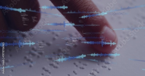 Pressing bare fingertip tracing raised Braille dots on light page at desk, showing blue waveforms