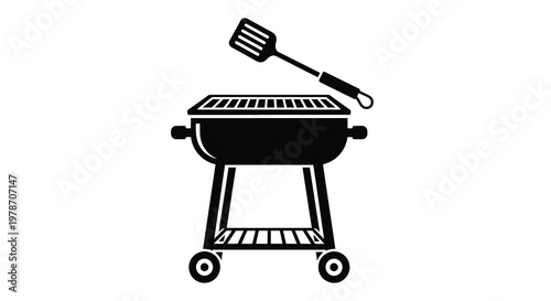 Black and white illustration of a portable charcoal grill with spatula