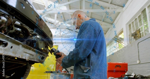 Grinding mechanic wearing blue coveralls on vehicle bumper with power tool and AR HUD, copy space
