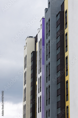 Fragment of modern high-rise residential buildings against the blue sky. Copyspace.