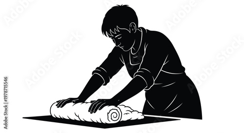 Black silhouette of a person rolling out dough on a table