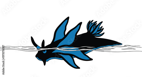 A blue and black manta ray swimming underwater with fins outstretched in ocean