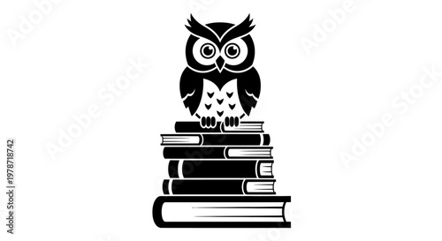 Owl sitting on stack of books.
