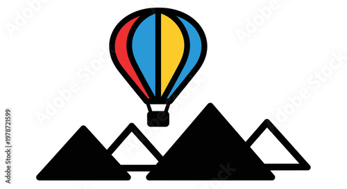 Colorful hot air balloon flying over pyramids.