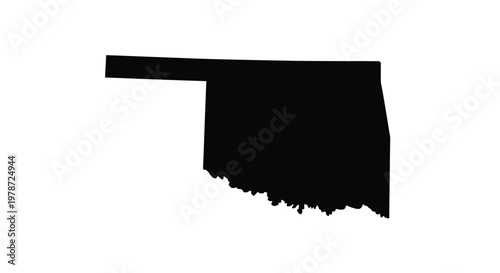 A stark black silhouette depicts the distinct geographical outline of the state of oklahoma