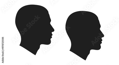 Silhouettes of two human heads in profile view stark contrast