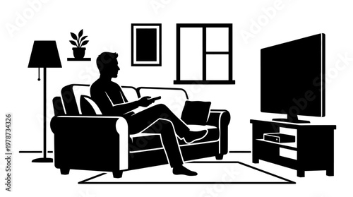 Man sitting on a couch reading.