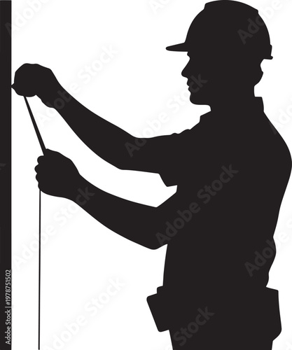 construction worker measuring with tape