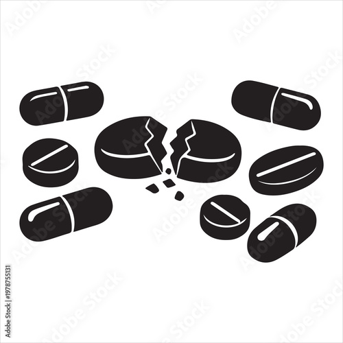 A group of black pills and capsules on a white background