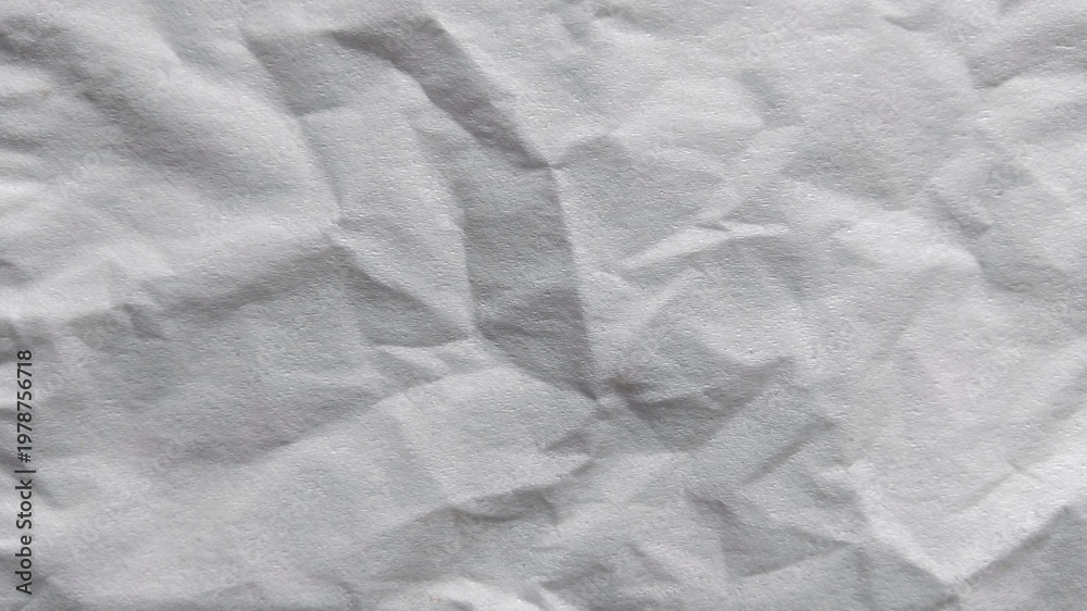 Fototapeta premium White crumpled paper texture background. Abstract wrinkled paper surface with shadows.