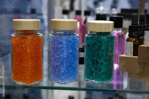 Принти на полотні Colored plastic jars with colored caps for storing blotting goods