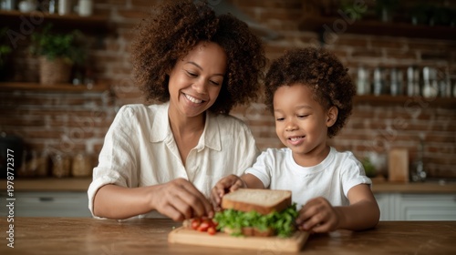 A joyful mother and her young son are happily preparing a sandwich together in a rustic kitchen setting, embodying bonding moments filled with laughter and love.