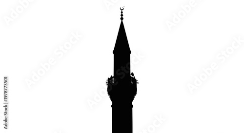 Silhouette of a tall tower with a spire.