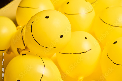 Creative Yellow Day Concept with Smile Balloon on Bright Monochrome Background
