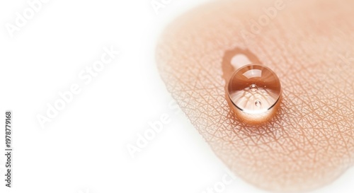Close-up of a Clear Water Drop on Human Skin Surface.
