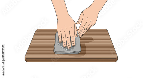 Two hands carefully wipe a damp surface on a beautiful striped wooden cutting board using a soft grey cloth within a bright and clean minimalist environment.