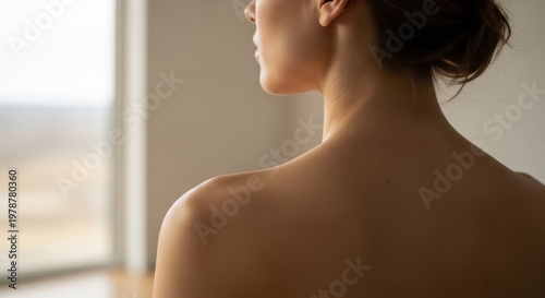 Womans Bare Shoulders and Neck in Natural Light.