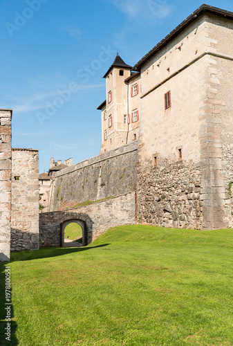 Wallpaper Mural Exterior space of Castel Thun, a Gothic medieval hilltop castle located in Vigo di Ton, Province of Trento, Italy. Historic fortress surrounded by alpine landscape and greenery. Torontodigital.ca