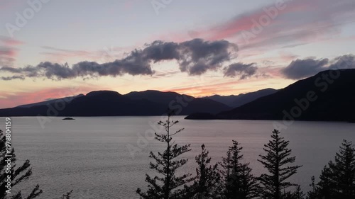 Vibrant Sunset Over Howe Sound, British Columbia: Majestic Mountains Reflecting in Calm Waters at Dusk
