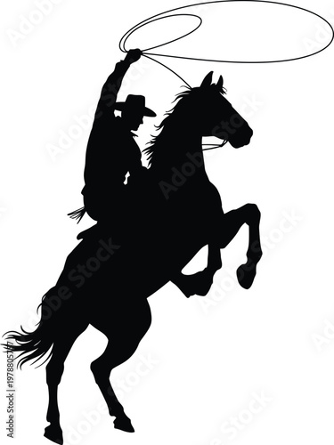 Black silhouette cowboy riding horse with lasso