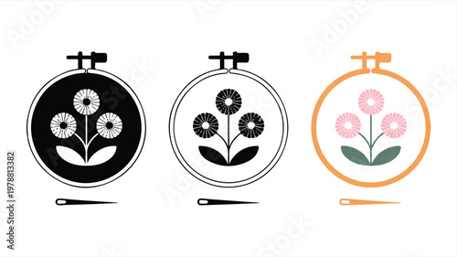 embroidery hoops with flowers and needles on white background