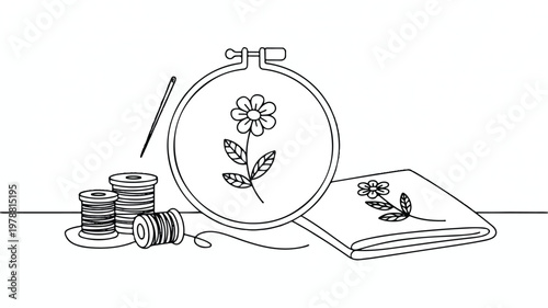 line drawing of embroidery hoop with flower design and sewing supplies