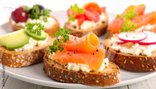 Assortment of open-faced sandwiches with various toppings, arranged on a white plate. Fresh ingredients, vibrant colors, and appealing presentation