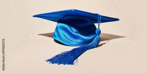 Graduation Cap Rests on a Simple Surface in a Bright Setting During the Celeb...