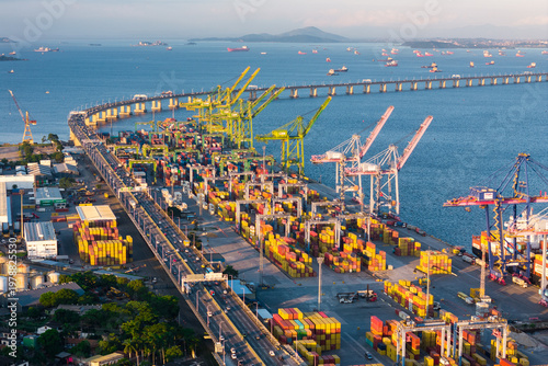 Aerial View of Docks Area Full of Containers in Rio de Janeiro City Port and The Bridge To Niteroi Crossing Guanabara Bay