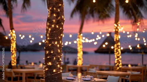 Dining Area by the Beach With String Lights at Sunset in a Tropical Location