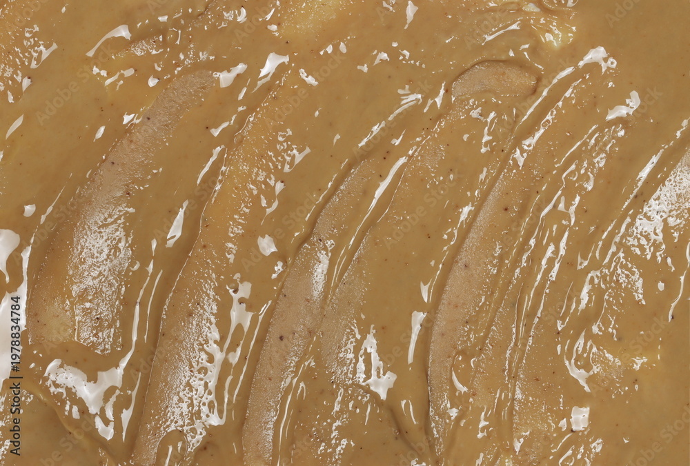 Obraz premium Cashew butter spread background and texture, top view