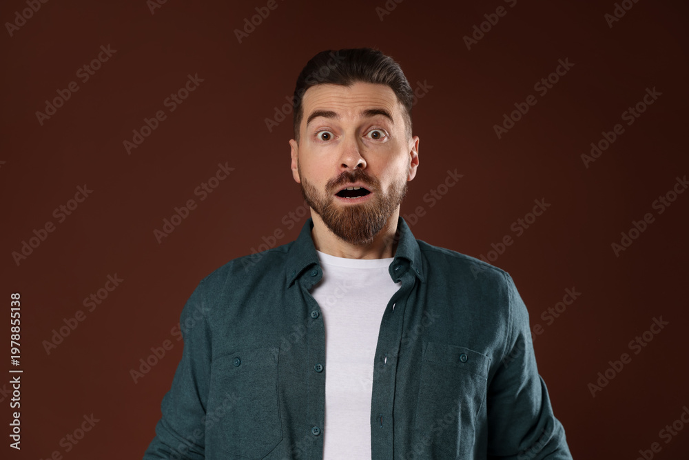 Obraz premium Resentment. Portrait of disturbed man on brown background