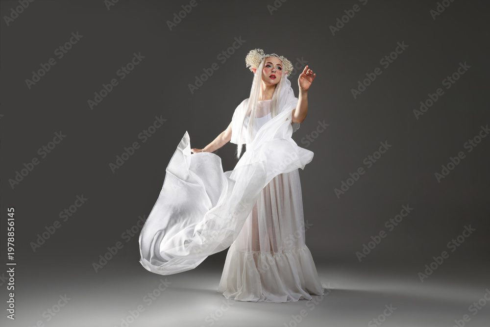 Naklejka premium Beautiful girl dressed as elf on grey background