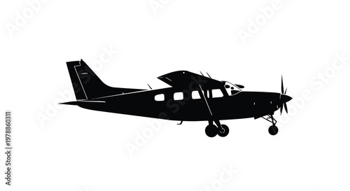 A black silhouette of a small single engine airplane in flight