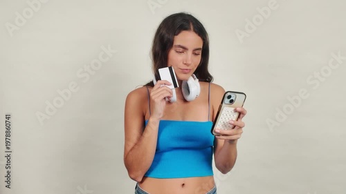 Young woman making online payment with smartphone