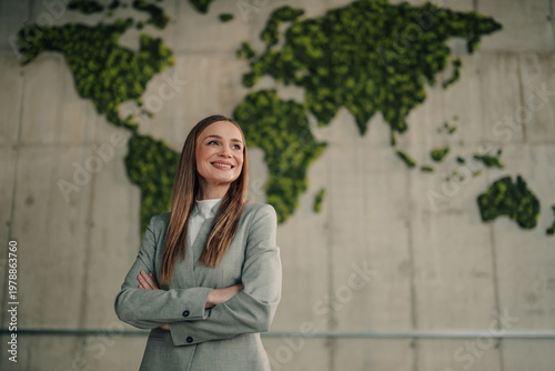 Businesswoman looking forward to sustainability and green corporate environmental responsibility