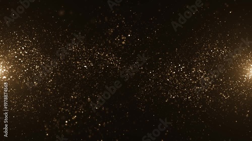Luxury event background with glittering shiny gold particles floating across the frame. This golden special occasion background is ideal for award ceremonies and talent shows.