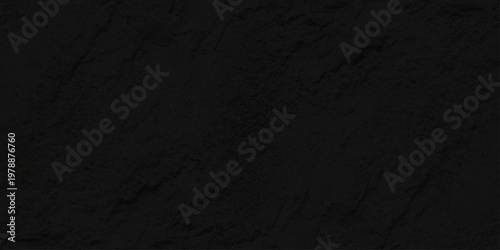 A dark textured black paper background with a rough gray surface pattern creates a macro material design suitable for a textile fabric or leather backdrop wallpaper